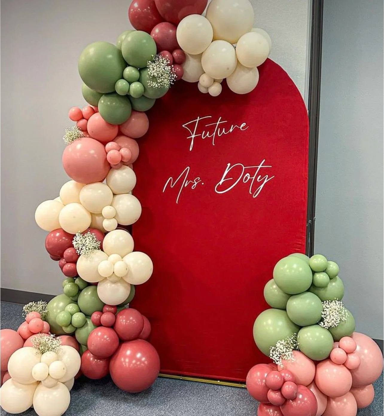 Future Mrs. lettering on a red arch with pink, cream and sage balloons
